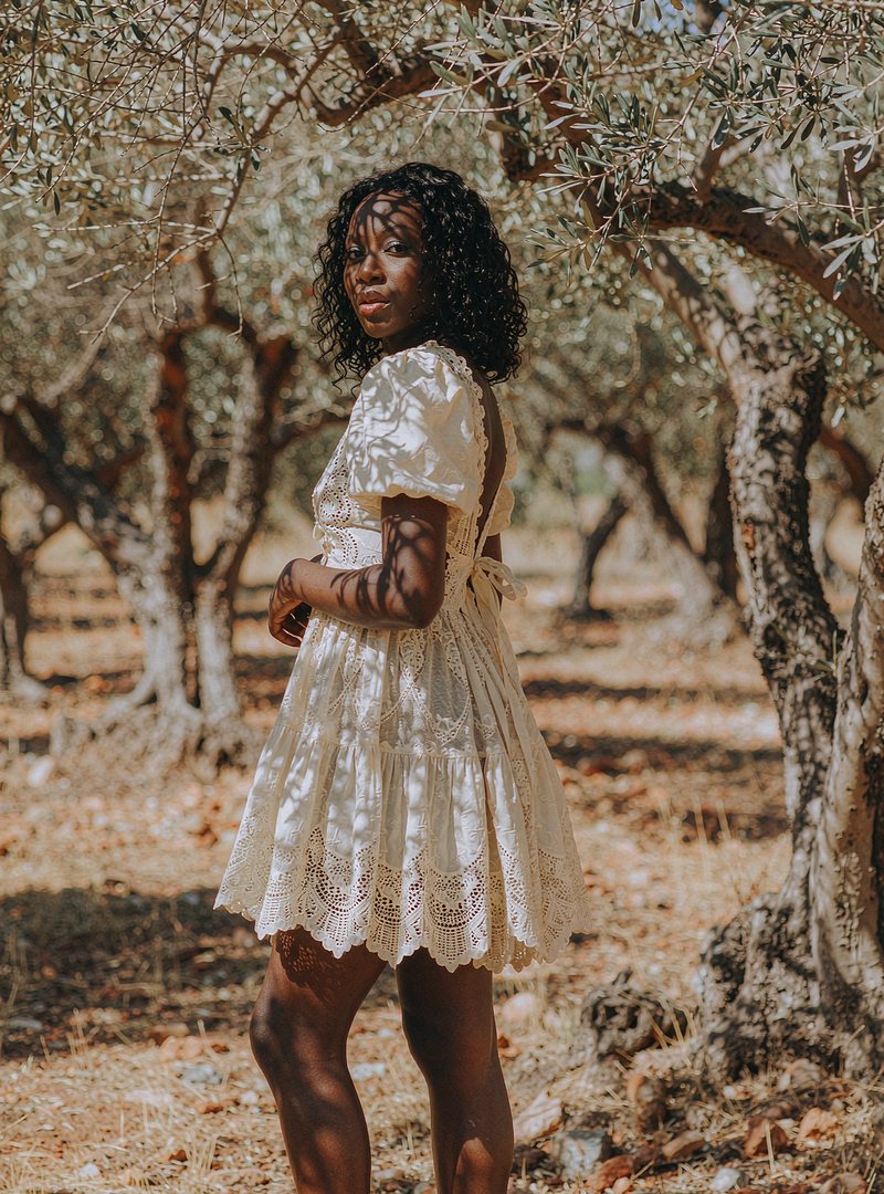 Delphine Lace Mini Dress — Ivory, modelled outdoors