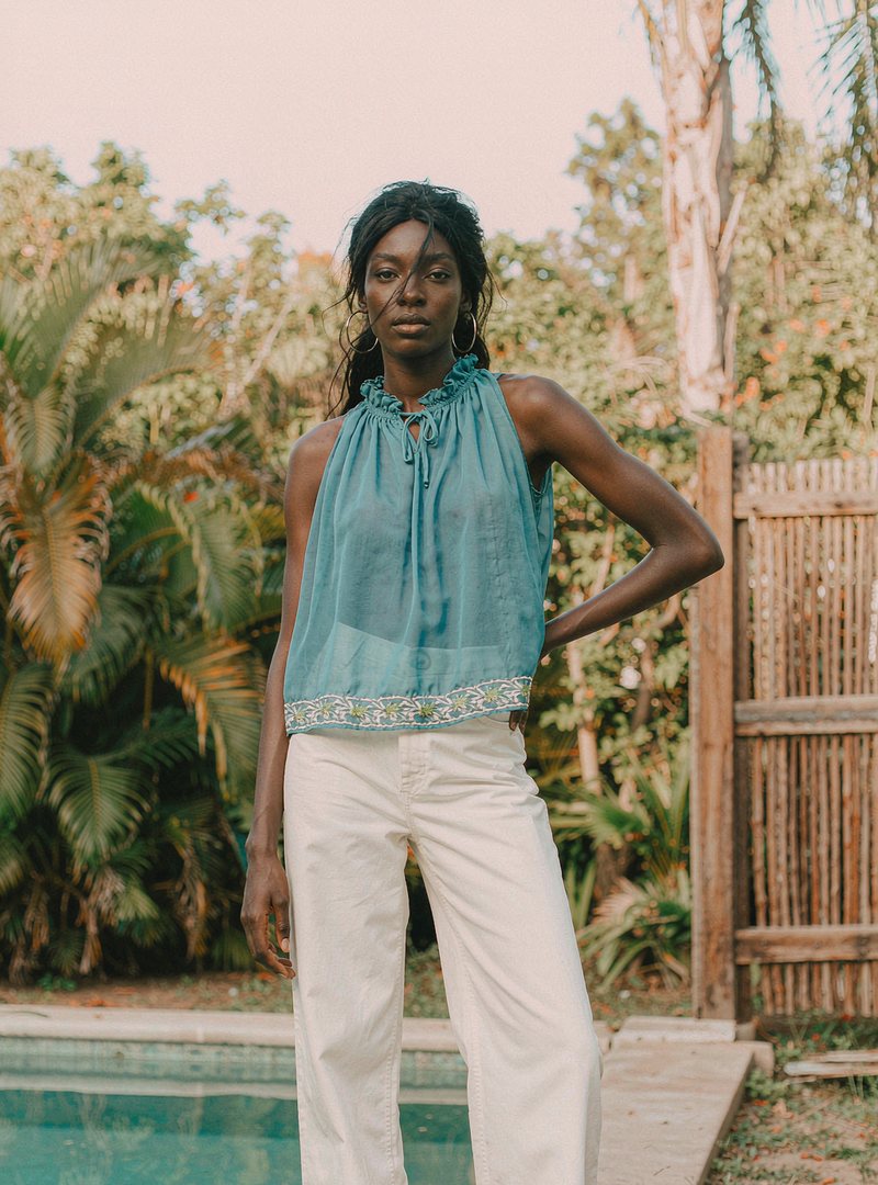 Fleur Frill Sleeveless Blouse — Lagoon, modelled outdoors