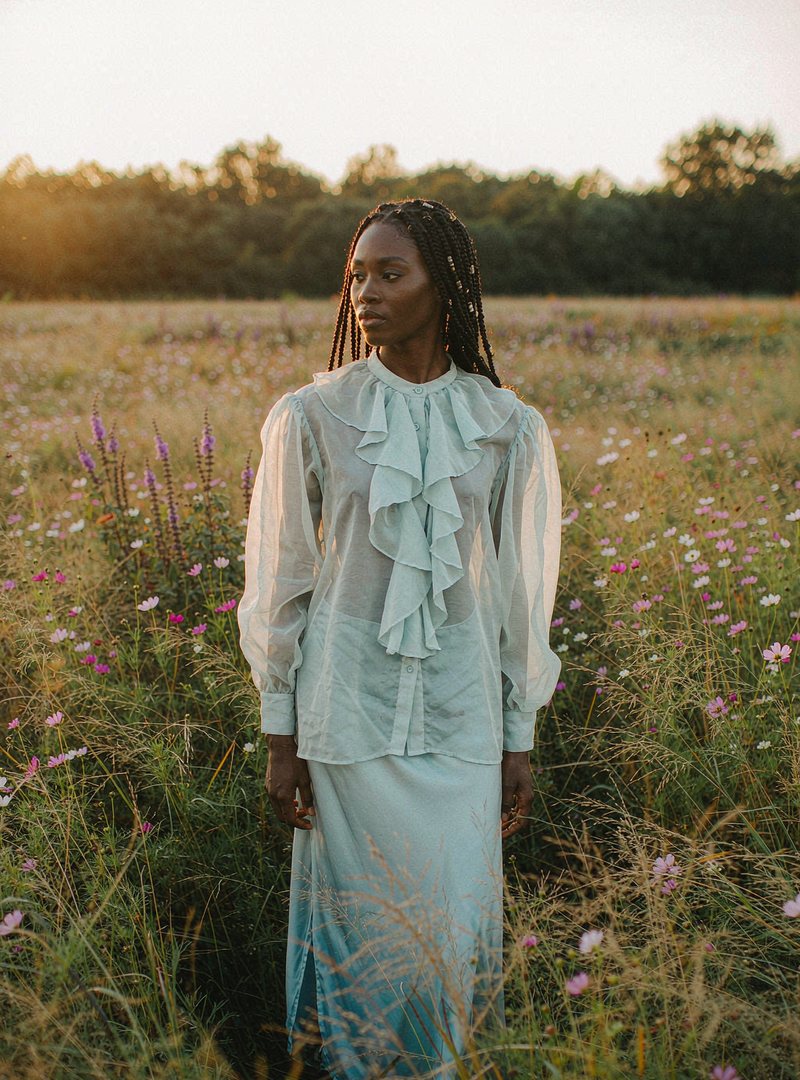 Alba Ruffle Blouse — Sky, modelled outdoors